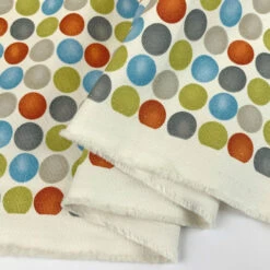 Canvas - To Wear Or Not To Wear? - Burned Orange 11 Canvas - To Wear Or Not To Wear? - Burned Orange -Croft Mill Store canvas to wear or not to wear burned orange multicolour spotty printed heavy cotton canvas craft fabric weight fabric photo