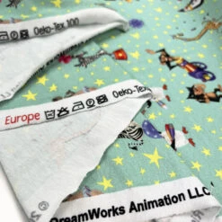 Licensed Jersey - Madagascar Circus -Croft Mill Store cotton elastane jersey fabric licensed madagascar aqua circus print fold