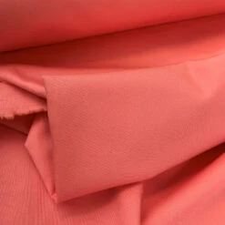 JK - Marmaris - Coral 5 JK - Marmaris - Coral -Croft Mill Store jk mamaris coral cotton stretch twilled trousering dress fabric close up fabric photo